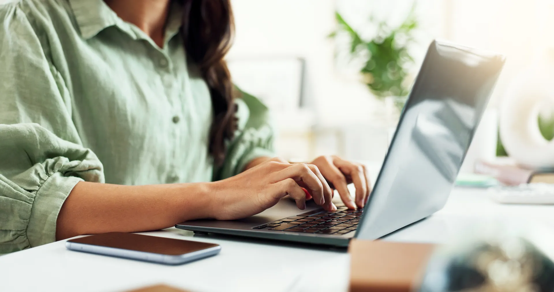 A person using a laptop at home